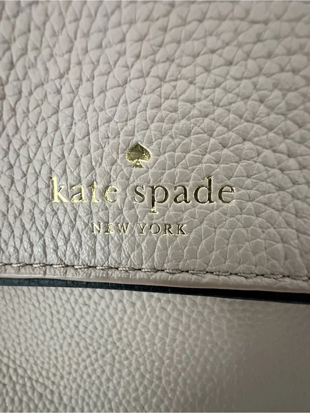 kate spade taupe pebbled leather shoulder bag with black tassel